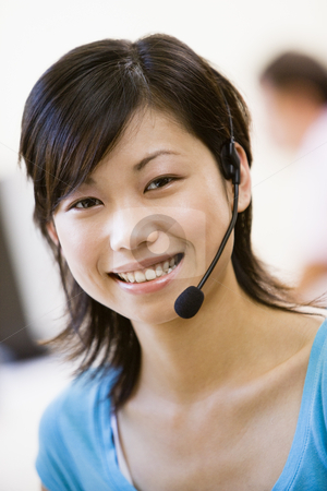 To use this stock image in your creative project, please select the size you need over to the right and click the "Add to Cart" button.
Your downloaded image will come with the Cutcaster watermark removed so don’t worry about the watermark you see on this page. Woman wearing headset indoors smiling stock photo, by Monkey Business Images