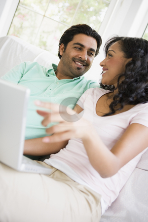 To use this stock image in your creative project, please select the size you need over to the right and click the "Add to Cart" button.
Your downloaded image will come with the Cutcaster watermark removed so don’t worry about the watermark you see on this page. A Middle Eastern couple sitting with a laptop stock photo, by Monkey Business Images