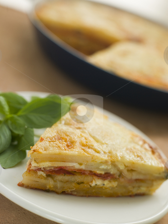 To use this stock image in your creative project, please select the size you need over to the right and click the "Add to Cart" button.
Your downloaded image will come with the Cutcaster watermark removed so don’t worry about the watermark you see on this page. Spanish Potato and Chorizo Sausage Omelette stock photo, by Monkey Business Images