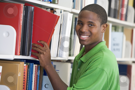 To use this stock image in your creative project, please select the size you need over to the right and click the "Add to Cart" button.
Your downloaded image will come with the Cutcaster watermark removed so don’t worry about the watermark you see on this page. University student choosing book in library stock photo, Male student selecting book in library by Monkey Business Images