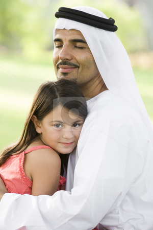 To use this stock image in your creative project, please select the size you need over to the right and click the "Add to Cart" button.
Your downloaded image will come with the Cutcaster watermark removed so don’t worry about the watermark you see on this page. A Middle Eastern man and his daughter sitting in a park stock photo, by Monkey Business Images