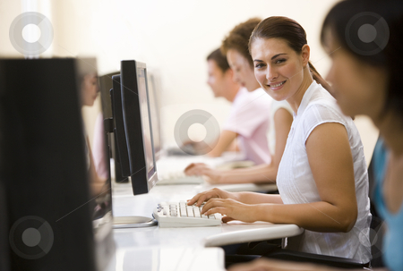 To use this stock image in your creative project, please select the size you need over to the right and click the "Add to Cart" button.
Your downloaded image will come with the Cutcaster watermark removed so don’t worry about the watermark you see on this page. Four people sitting in computer room typing and smiling stock photo, by Monkey Business Images