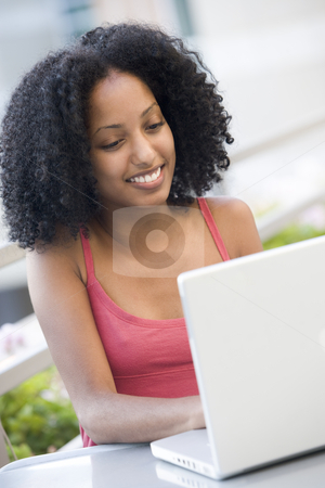 To use this stock image in your creative project, please select the size you need over to the right and click the "Add to Cart" button.
Your downloaded image will come with the Cutcaster watermark removed so don’t worry about the watermark you see on this page. Female student using laptop computer outside stock photo, Female university student working outside by Monkey Business Images