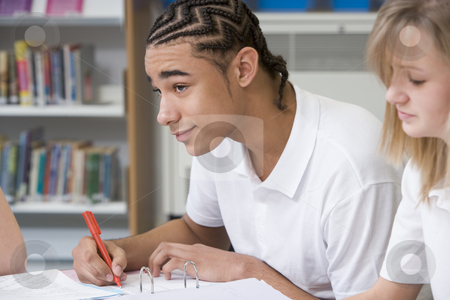To use this stock image in your creative project, please select the size you need over to the right and click the "Add to Cart" button.
Your downloaded image will come with the Cutcaster watermark removed so don’t worry about the watermark you see on this page. Student studying in library stock photo, by Monkey Business Images