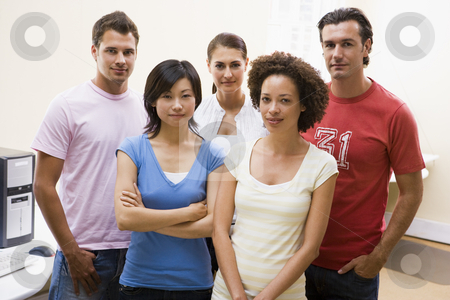 To use this stock image in your creative project, please select the size you need over to the right and click the "Add to Cart" button.
Your downloaded image will come with the Cutcaster watermark removed so don’t worry about the watermark you see on this page. Five people standing in computer room stock photo, by Monkey Business Images