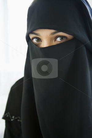 To use this stock image in your creative project, please select the size you need over to the right and click the "Add to Cart" button.
Your downloaded image will come with the Cutcaster watermark removed so don’t worry about the watermark you see on this page. Portrait of a middle eastern woman wearing a black hijab stock photo, by Monkey Business Images