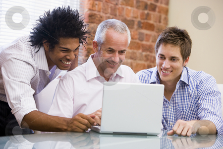 To use this stock image in your creative project, please select the size you need over to the right and click the "Add to Cart" button.
Your downloaded image will come with the Cutcaster watermark removed so don’t worry about the watermark you see on this page. Three businessmen sitting in office with laptop smiling stock photo, by Monkey Business Images