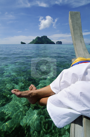 To use this stock image in your creative project, please select the size you need over to the right and click the "Add to Cart" button.
Your downloaded image will come with the Cutcaster watermark removed so don’t worry about the watermark you see on this page. Man on pier dangling feet over clear water stock photo, by Monkey Business Images
