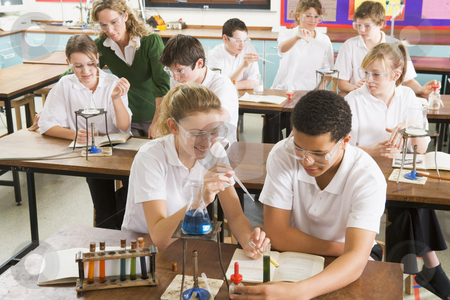 To use this stock image in your creative project, please select the size you need over to the right and click the "Add to Cart" button.
Your downloaded image will come with the Cutcaster watermark removed so don’t worry about the watermark you see on this page. Schoolchildren and teacher in science class stock photo, by Monkey Business Images