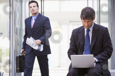 To use this stock image in your creative project, please select the size you need over to the right and click the "Add to Cart" button.
Your downloaded image will come with the Cutcaster watermark removed so don’t worry about the watermark you see on this page. Businessman working at laptop outside stock photo, Businessman working at laptop outside office by Monkey Business Images