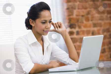 To use this stock image in your creative project, please select the size you need over to the right and click the "Add to Cart" button.
Your downloaded image will come with the Cutcaster watermark removed so don’t worry about the watermark you see on this page. Businesswoman in office with laptop stock photo, by Monkey Business Images