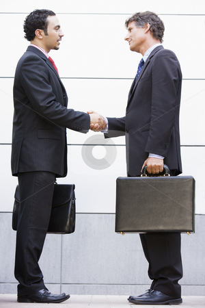 To use this stock image in your creative project, please select the size you need over to the right and click the "Add to Cart" button.
Your downloaded image will come with the Cutcaster watermark removed so don’t worry about the watermark you see on this page. Businessmen meeting outside office stock photo, Businessmen meeting outside modern office by Monkey Business Images