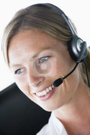 To use this stock image in your creative project, please select the size you need over to the right and click the "Add to Cart" button.
Your downloaded image will come with the Cutcaster watermark removed so don’t worry about the watermark you see on this page. Businesswoman in office wearing headset and smiling stock photo, by Monkey Business Images