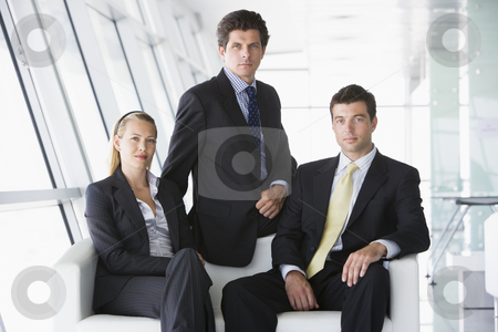 To use this stock image in your creative project, please select the size you need over to the right and click the "Add to Cart" button.
Your downloaded image will come with the Cutcaster watermark removed so don’t worry about the watermark you see on this page. Three businesspeople sitting in office lobby stock photo, by Monkey Business Images