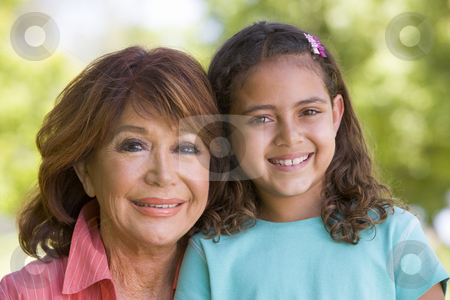 To use this stock image in your creative project, please select the size you need over to the right and click the "Add to Cart" button.
Your downloaded image will come with the Cutcaster watermark removed so don’t worry about the watermark you see on this page. Grandmother and granddaughter smiling stock photo, by Monkey Business Images