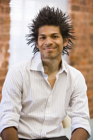 To use this stock image in your creative project, please select the size you need over to the right and click the "Add to Cart" button.
Your downloaded image will come with the Cutcaster watermark removed so don’t worry about the watermark you see on this page. Businessman sitting in office space smiling stock photo, by Monkey Business Images