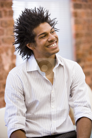 To use this stock image in your creative project, please select the size you need over to the right and click the "Add to Cart" button.
Your downloaded image will come with the Cutcaster watermark removed so don’t worry about the watermark you see on this page. Businessman sitting in office space smiling stock photo, by Monkey Business Images