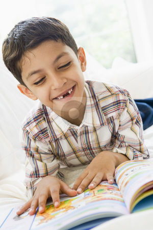 To use this stock image in your creative project, please select the size you need over to the right and click the "Add to Cart" button.
Your downloaded image will come with the Cutcaster watermark removed so don’t worry about the watermark you see on this page. A Middle Eastern boy reading a book stock photo, by Monkey Business Images