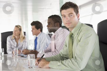 To use this stock image in your creative project, please select the size you need over to the right and click the "Add to Cart" button.
Your downloaded image will come with the Cutcaster watermark removed so don’t worry about the watermark you see on this page. Four businesspeople in a boardroom stock photo, by Monkey Business Images