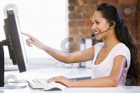To use this stock image in your creative project, please select the size you need over to the right and click the "Add to Cart" button.
Your downloaded image will come with the Cutcaster watermark removed so don’t worry about the watermark you see on this page. Businesswoman in office wearing headset and pointing at computer stock photo, by Monkey Business Images