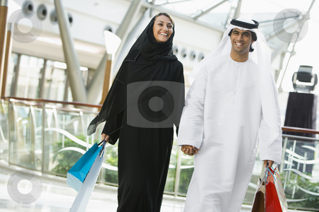 To use this stock image in your creative project, please select the size you need over to the right and click the "Add to Cart" button.
Your downloaded image will come with the Cutcaster watermark removed so don’t worry about the watermark you see on this page. A Middle Eastern couple in a shopping mall stock photo, by Monkey Business Images