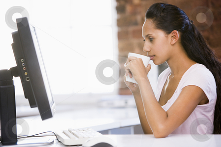 To use this stock image in your creative project, please select the size you need over to the right and click the "Add to Cart" button.
Your downloaded image will come with the Cutcaster watermark removed so don’t worry about the watermark you see on this page. Businesswoman in office drinking coffee and looking at computer stock photo, by Monkey Business Images