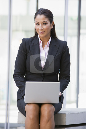 To use this stock image in your creative project, please select the size you need over to the right and click the "Add to Cart" button.
Your downloaded image will come with the Cutcaster watermark removed so don’t worry about the watermark you see on this page. Businesswoman using laptop computer outside stock photo, Businesswoman using laptop computer outside by Monkey Business Images