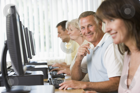 To use this stock image in your creative project, please select the size you need over to the right and click the "Add to Cart" button.
Your downloaded image will come with the Cutcaster watermark removed so don’t worry about the watermark you see on this page. Adult students in a computer lab stock photo, by Monkey Business Images