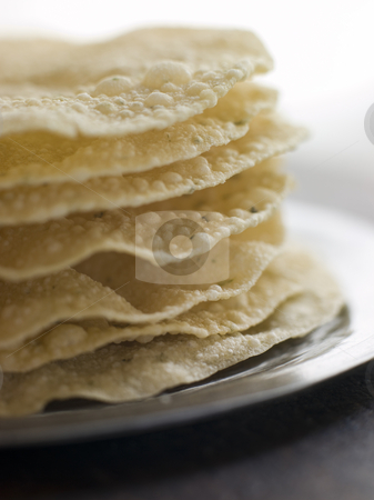 To use this stock image in your creative project, please select the size you need over to the right and click the "Add to Cart" button.
Your downloaded image will come with the Cutcaster watermark removed so don’t worry about the watermark you see on this page. Stack of cooked Papadoms stock photo, Close up of Stack of cooked Papadoms by Monkey Business Images