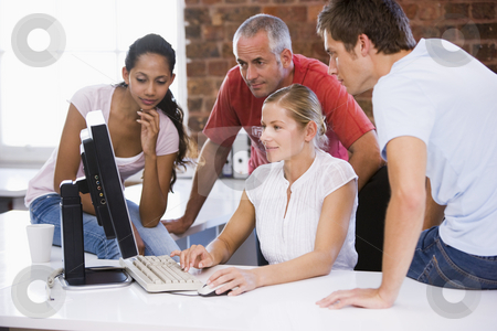 To use this stock image in your creative project, please select the size you need over to the right and click the "Add to Cart" button.
Your downloaded image will come with the Cutcaster watermark removed so don’t worry about the watermark you see on this page. Four businesspeople in office space looking at computer smiling stock photo, by Monkey Business Images