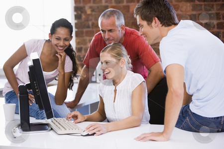 To use this stock image in your creative project, please select the size you need over to the right and click the "Add to Cart" button.
Your downloaded image will come with the Cutcaster watermark removed so don’t worry about the watermark you see on this page. Five businesspeople in office space looking at computer smiling stock photo, by Monkey Business Images