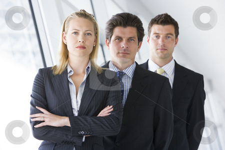 To use this stock image in your creative project, please select the size you need over to the right and click the "Add to Cart" button.
Your downloaded image will come with the Cutcaster watermark removed so don’t worry about the watermark you see on this page. Three businesspeople standing in corridor stock photo, by Monkey Business Images