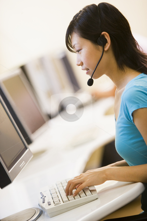 To use this stock image in your creative project, please select the size you need over to the right and click the "Add to Cart" button.
Your downloaded image will come with the Cutcaster watermark removed so don’t worry about the watermark you see on this page. Woman wearing headset sitting in computer room typing stock photo, by Monkey Business Images