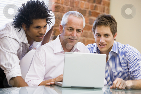 To use this stock image in your creative project, please select the size you need over to the right and click the "Add to Cart" button.
Your downloaded image will come with the Cutcaster watermark removed so don’t worry about the watermark you see on this page. Three businessmen in office looking at laptop smiling stock photo, by Monkey Business Images
