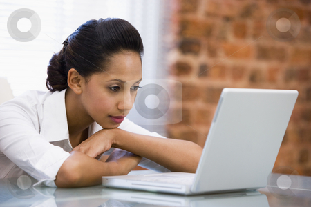To use this stock image in your creative project, please select the size you need over to the right and click the "Add to Cart" button.
Your downloaded image will come with the Cutcaster watermark removed so don’t worry about the watermark you see on this page. Businesswoman in office with laptop stock photo, by Monkey Business Images