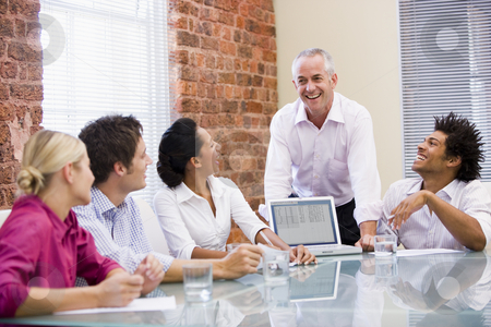 To use this stock image in your creative project, please select the size you need over to the right and click the "Add to Cart" button.
Your downloaded image will come with the Cutcaster watermark removed so don’t worry about the watermark you see on this page. Five businesspeople in boardroom with laptop laughing stock photo, by Monkey Business Images