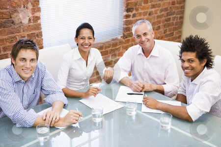 To use this stock image in your creative project, please select the size you need over to the right and click the "Add to Cart" button.
Your downloaded image will come with the Cutcaster watermark removed so don’t worry about the watermark you see on this page. Four businesspeople in boardroom smiling stock photo, by Monkey Business Images