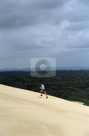 To use this stock image in your creative project, please select the size you need over to the right and click the "Add to Cart" button.
Your downloaded image will come with the Cutcaster watermark removed so don’t worry about the watermark you see on this page. Man running up sand dune stock photo, by Monkey Business Images