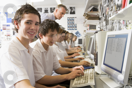 To use this stock image in your creative project, please select the size you need over to the right and click the "Add to Cart" button.
Your downloaded image will come with the Cutcaster watermark removed so don’t worry about the watermark you see on this page. Row of schoolchildren studying in front of a computer stock photo, by Monkey Business Images