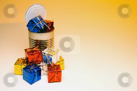 To use this stock image in your creative project, please select the size you need over to the right and click the "Add to Cart" button.
Your downloaded image will come with the Cutcaster watermark removed so don’t worry about the watermark you see on this page. Can-O-Presents stock photo, A tin can overflowing with Christmas presents. by Robert Byron
