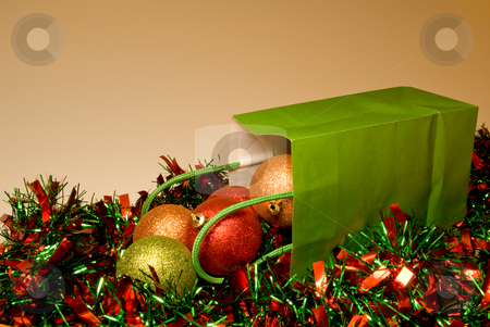 To use this stock image in your creative project, please select the size you need over to the right and click the "Add to Cart" button.
Your downloaded image will come with the Cutcaster watermark removed so don’t worry about the watermark you see on this page. Christmas Ornaments stock photo, A pile of Christmas ornaments in a gift bag. by Robert Byron