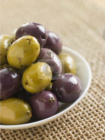 To use this stock image in your creative project, please select the size you need over to the right and click the "Add to Cart" button.
Your downloaded image will come with the Cutcaster watermark removed so don’t worry about the watermark you see on this page. Dish of marinated Olives stock photo, by Monkey Business Images