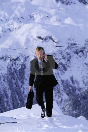 To use this stock image in your creative project, please select the size you need over to the right and click the "Add to Cart" button.
Your downloaded image will come with the Cutcaster watermark removed so don’t worry about the watermark you see on this page. Businessman outdoors on snowy mountain using cellular phone stock photo, by Monkey Business Images