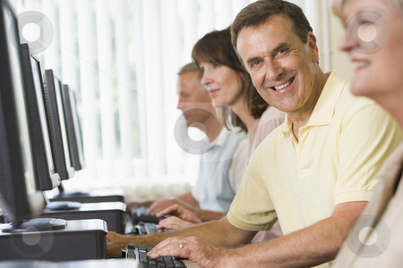 To use this stock image in your creative project, please select the size you need over to the right and click the "Add to Cart" button.
Your downloaded image will come with the Cutcaster watermark removed so don’t worry about the watermark you see on this page. Adult students in a computer lab stock photo, by Monkey Business Images