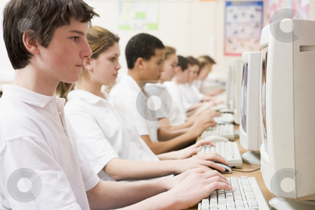 To use this stock image in your creative project, please select the size you need over to the right and click the "Add to Cart" button.
Your downloaded image will come with the Cutcaster watermark removed so don’t worry about the watermark you see on this page. Row of schoolchildren studying in front of a computer stock photo, by Monkey Business Images