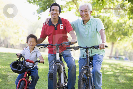 To use this stock image in your creative project, please select the size you need over to the right and click the "Add to Cart" button.
Your downloaded image will come with the Cutcaster watermark removed so don’t worry about the watermark you see on this page. Grandfather son and grandson bike riding stock photo, by Monkey Business Images