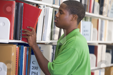 To use this stock image in your creative project, please select the size you need over to the right and click the "Add to Cart" button.
Your downloaded image will come with the Cutcaster watermark removed so don’t worry about the watermark you see on this page. University student slecting book from library shelf stock photo, Male student selecting book from library shelf by Monkey Business Images