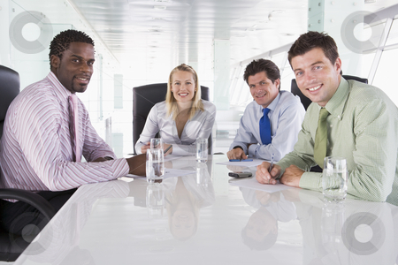 To use this stock image in your creative project, please select the size you need over to the right and click the "Add to Cart" button.
Your downloaded image will come with the Cutcaster watermark removed so don’t worry about the watermark you see on this page. Four businesspeople in a boardroom smiling stock photo, by Monkey Business Images