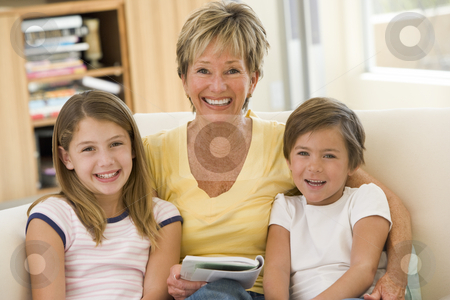 To use this stock image in your creative project, please select the size you need over to the right and click the "Add to Cart" button.
Your downloaded image will come with the Cutcaster watermark removed so don’t worry about the watermark you see on this page. Grandmother reading with grandchildren stock photo, by Monkey Business Images