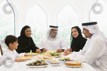 To use this stock image in your creative project, please select the size you need over to the right and click the "Add to Cart" button.
Your downloaded image will come with the Cutcaster watermark removed so don’t worry about the watermark you see on this page. A Middle Eastern family enjoying a meal stock photo, by Monkey Business Images